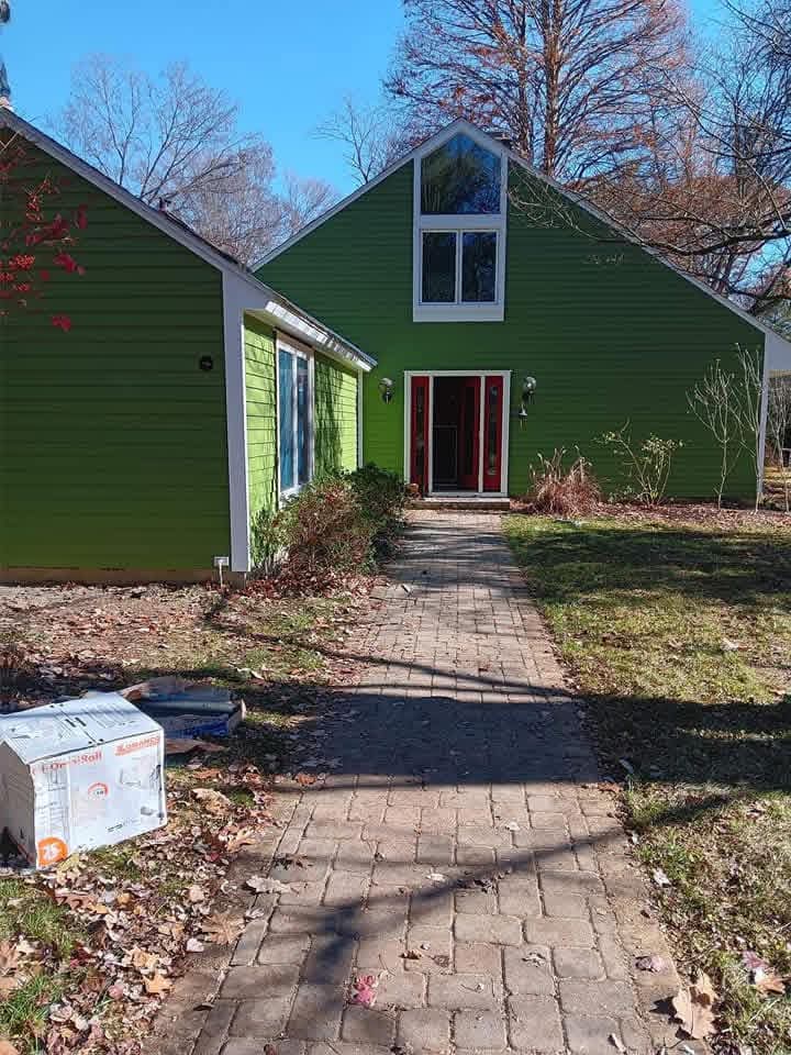 Exterior repaint – green siding home